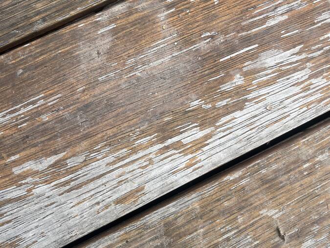 Timber deck stripped back & re-stained — the same yard before work started